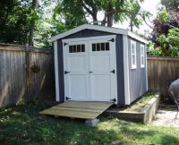 Dark Gable Shed with White Trim